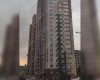 Непогода в Киеве: сильный ветер срывает фасад жилой многоэтажки (видео)