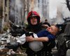 Обстріл "Кинджалами": у ДСНС показали порятунок людей та гасіння пожеж у Києві (фото)