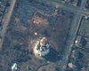 Maxar показал спутниковые снимки братской могилы в Буче (фото)