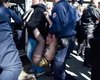 Активистки Femen устроили акцию на первомайском митинге Марин Ле Пен