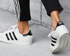 Европейский суд отказался признать торговой маркой логотип компании Adidas