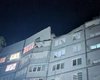 "Заблокированы люди": оккупанты обстреляли спальный район Харькова, повредив многоэтажки (видео)