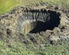 В вечной мерзлоте Сибири открывается все больше "Врат в ад": по два "бездонных" провала в год (фото)