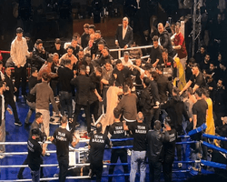 Боксера из РФ забросали стульями после чемпионского боя: на ринге произошла массовая драка (видео)