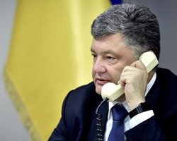 Порошенко экстренно прервал визит в Германию из-за Авдеевки