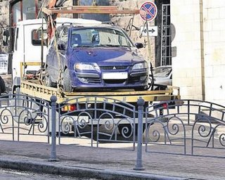 У депутатов от БЮТ и КПУ с парковки под отелем забрали автомобили