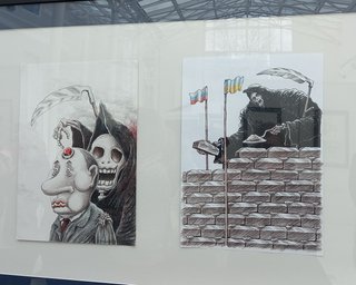 Нутро війни. У Києві відкрилася виставка жорстких карикатур на Путіна (фото)