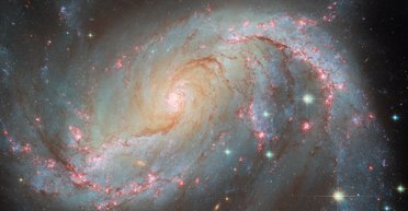 Яскравіше за Сонце в 100 млрд разів: телескоп Габбл зробив знімок галактики з "сюрпризом" усередині (фото)