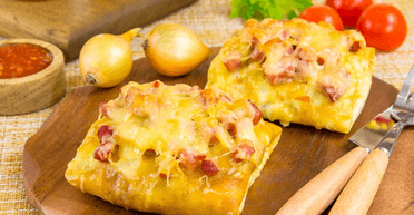 Млинці, фаршировані шинкою та сиром: просто, швидко і дуже смачно