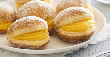 Пончики "Бола де Берлім" із заварним кремом: рецепт ароматної португальської випічки