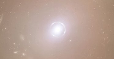 Астрономи побачили ідеальне кільце Ейнштейна, що сяє в глибокому космосі: що це (фото)