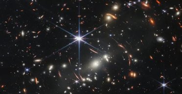 Астрономи виявили нову найдальшу галактику у Всесвіті: чим вона дивує (фото)