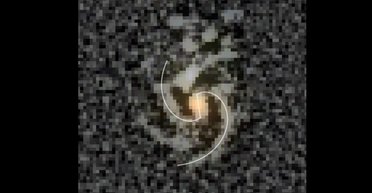 Схожа на Чумацький Шлях: виявлено найранішу спіральну галактику з перемичкою (фото)