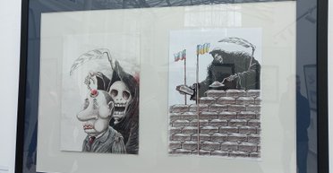 Нутро войны. В Киеве открылась выставка жестких карикатур на Путина (фото)