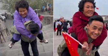 Чоловік подорожує країною з паралізованою матір'ю на спині (відео)