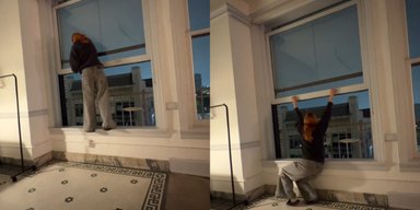 "Сердце ушло в пятки": девушка напугала попыткой закрыть окно в столетнем здании (видео)