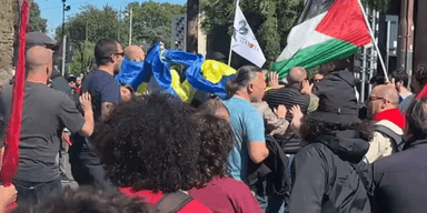 Скандал у Римі: під час маніфестації невідомі напали на людей з українськими прапорами (відео)