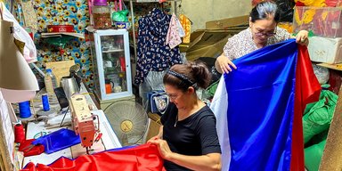 Шьют флаги РФ, которыми украсят улицы: Вьетнам готовится к приезду Путина после КНДР (фото)