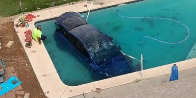 Як у кіно: електромобіль Tesla опинився в басейні після ДТП (відео)