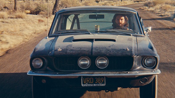 Джим Моррисон за рулем своего Ford Mustang Shelby GT500