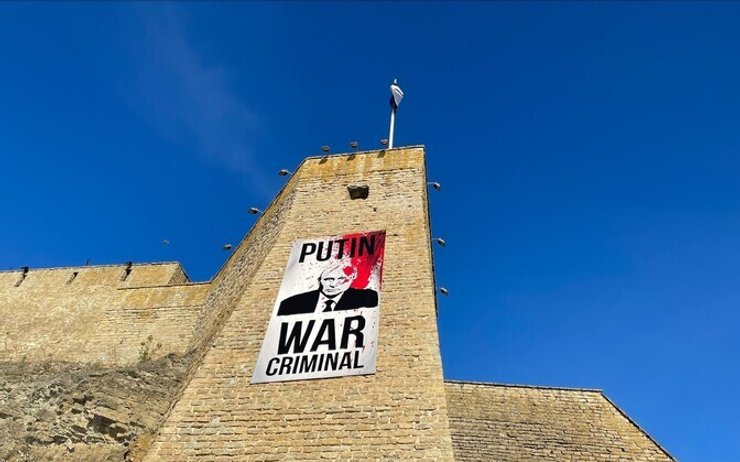 Плакат із Путіним