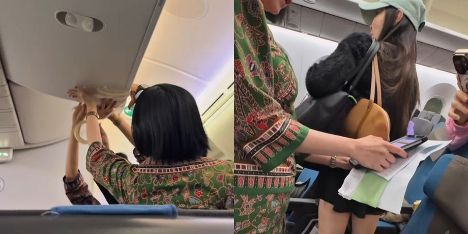 Стюардеси Singapore Airlines заклеюють верхній відсік для ручної поклажі, що протікає, клейкою стрічкою під час польоту