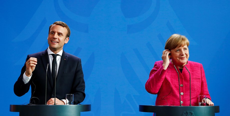 Макрон и Меркель / Фото с сайта defenseworld.net