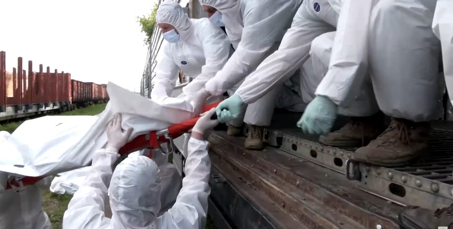 Тела российских солдат, вагоны-рефрижераторы, убитые оккупанты