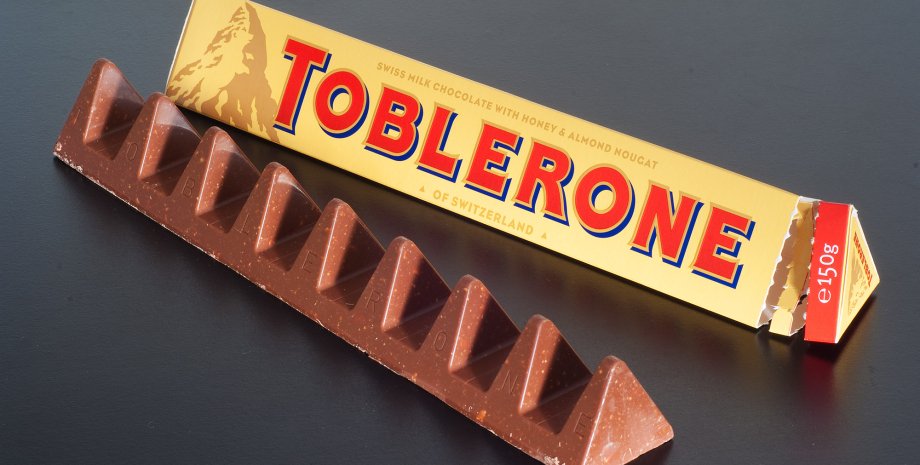 Швейцарія, шоколад Toblerone, логотип компанії Toblerone, упаковка шоколаду