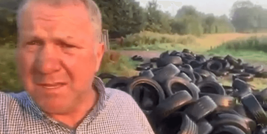 Чоловік помстився злочинцеві, акт відплати, фермер, на ферму скинули тонни сміття, зношені шини, купа шин, вантажівка зі сміттям