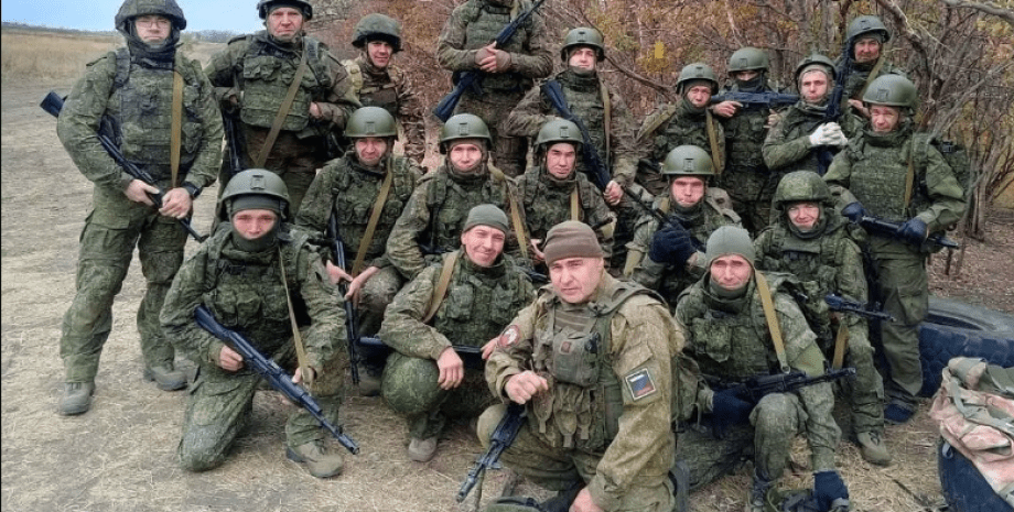 Ukrainian military personnel after the invaders executed nine fighters of the Ar...