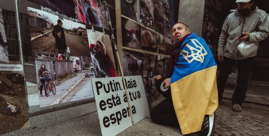 україна, війна, прапор, воєнні злочини, розслідування, португалія