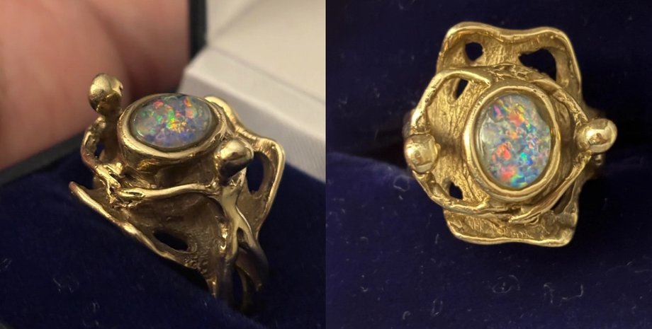 Необычное кольцо из 9-каратного золота с опалом в центре и фигурками по бокам