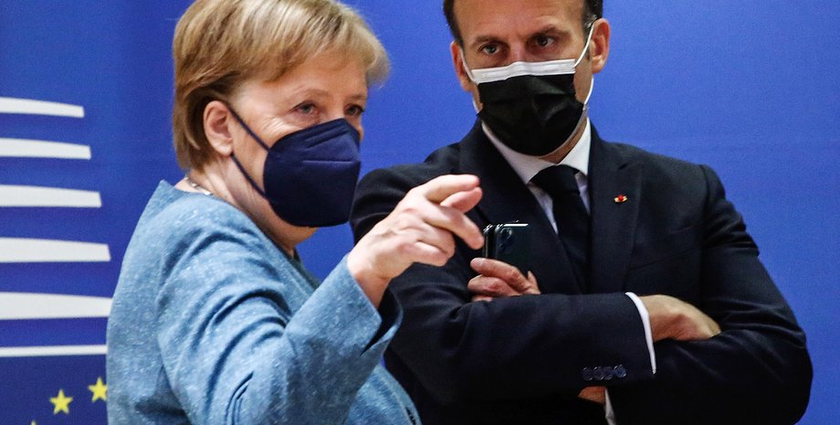 Ангела Меркель і Емманюель Макрон в масках