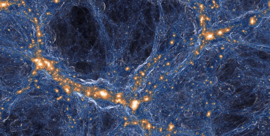 Вкрапления древнего газа скрываются внутри синих нитей, соединяющих оранжевые галактики. TNG COLLABORATION