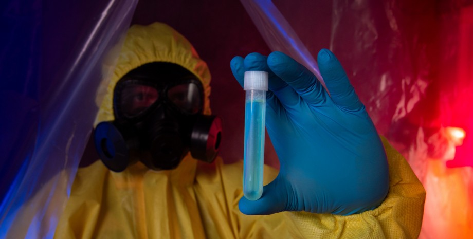 человек в костюме химзащиты с пробиркой биологическое оружие, химзащита, ученый, патоген, колба