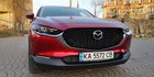 Mazda CX-30, вид спереди, экстерьер, решетка радиатора, фары, фото