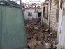 Поврежденные дома после обстрела